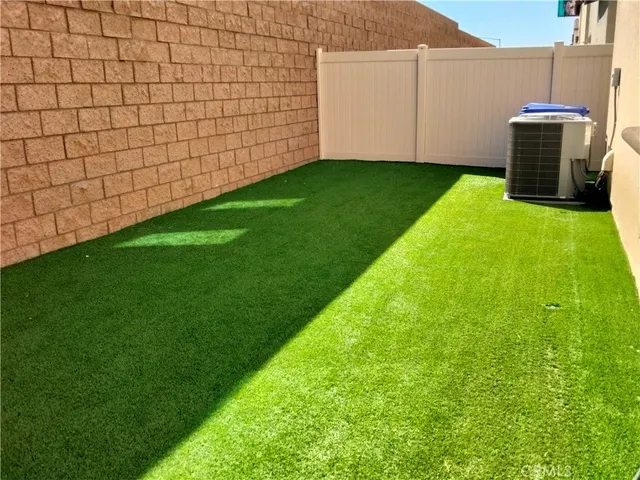 a view of a backyard with tub