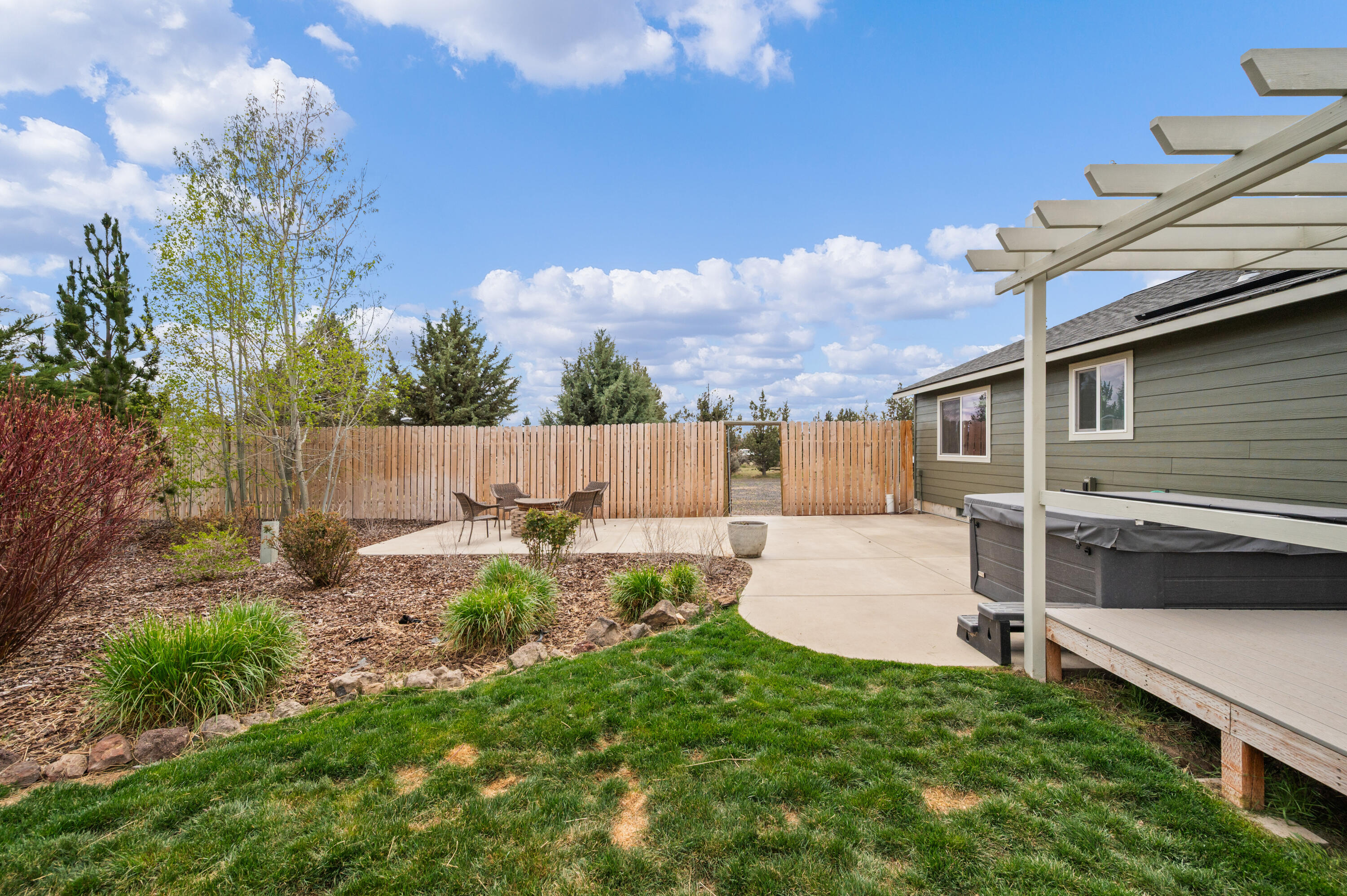 16625 Southwest Dove Road Terrebonne, OR 97760 - Photo 36 of 50 a backyard of a house with table and chairs
