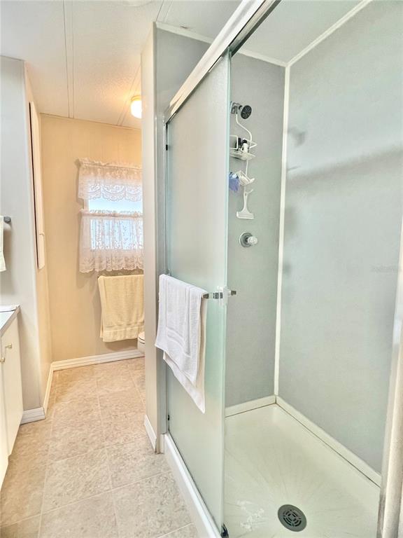 1100 South Belcher Road, Unit 197 Largo, FL 33771 - Photo 11 of 60 a bathroom with a tub shower and a sink