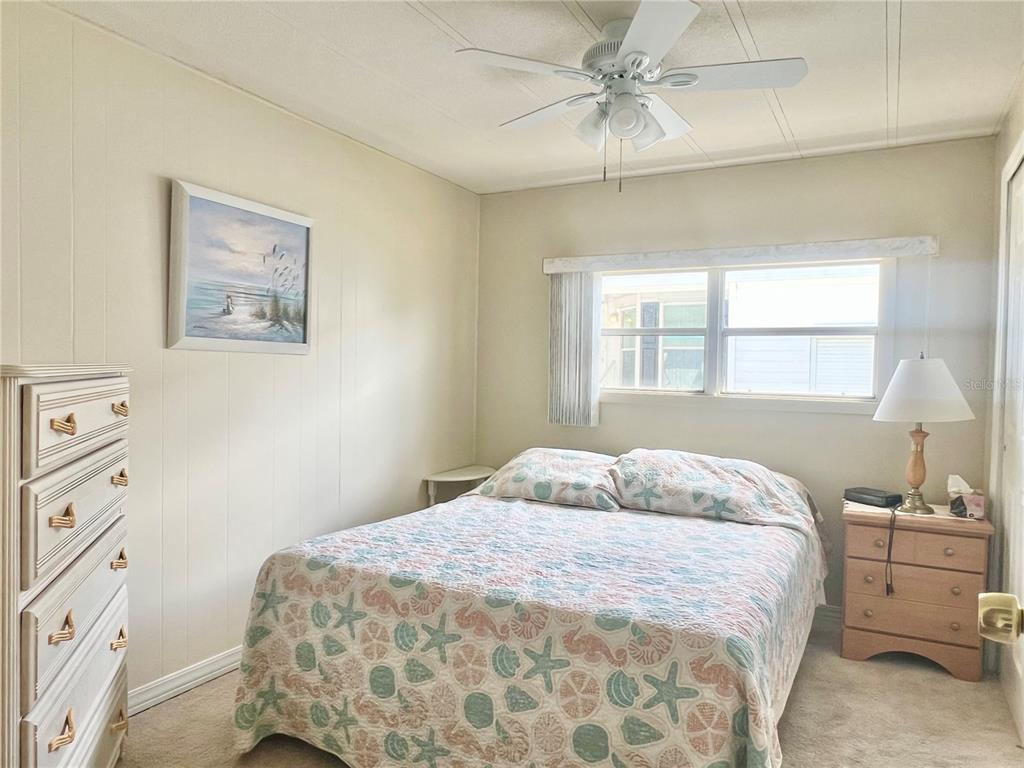 1100 South Belcher Road, Unit 197 Largo, FL 33771 - Photo 21 of 60 a bedroom with a bed and a window