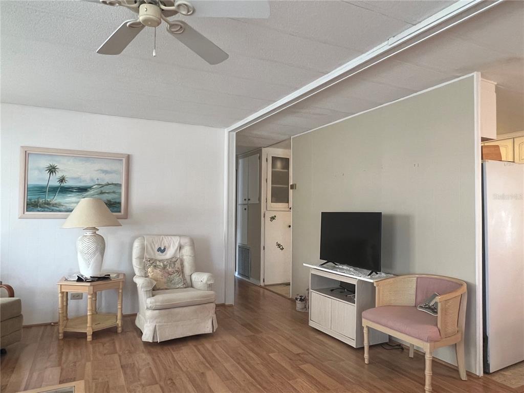 1100 South Belcher Road, Unit 197 Largo, FL 33771 - Photo 22 of 60 a living room with furniture and a flat screen tv