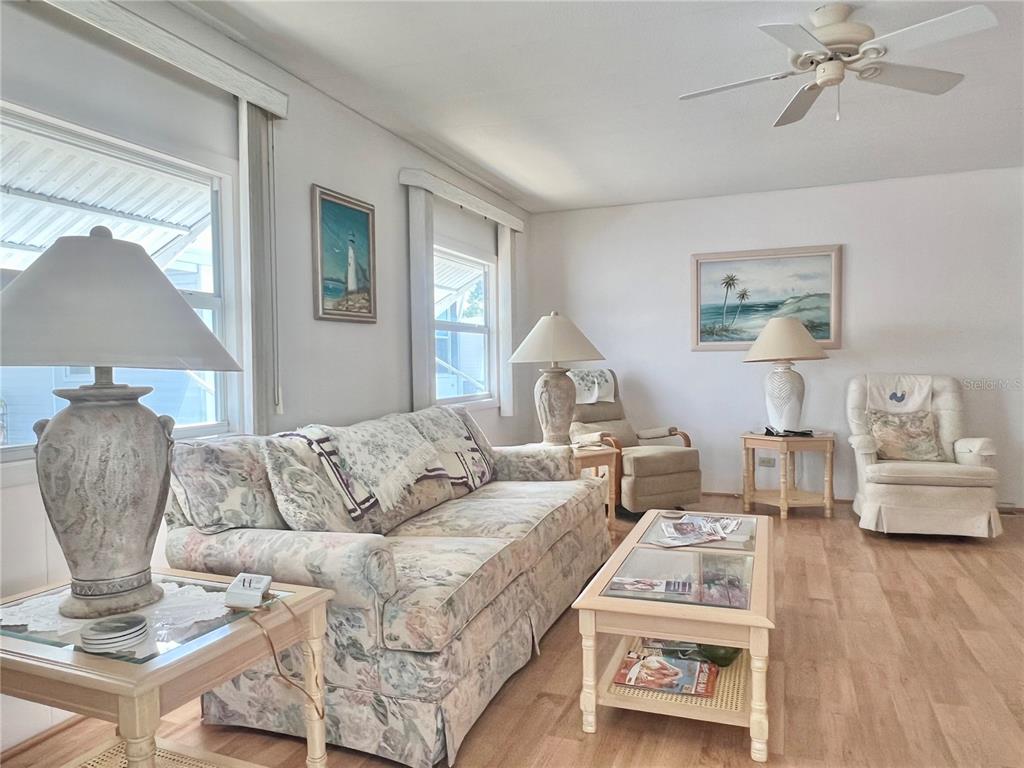 1100 South Belcher Road, Unit 197 Largo, FL 33771 - Photo 23 of 60 a living room with furniture and a wooden floor