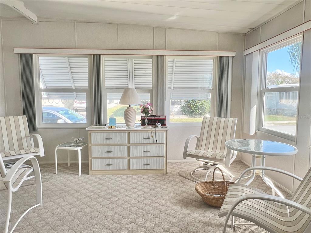 1100 South Belcher Road, Unit 197 Largo, FL 33771 - Photo 25 of 60 a living room with furniture and a large window