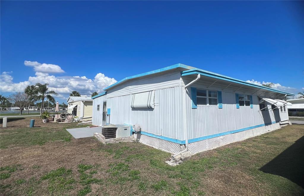 1100 South Belcher Road, Unit 197 Largo, FL 33771 - Photo 27 of 60 a view of a house with a yard