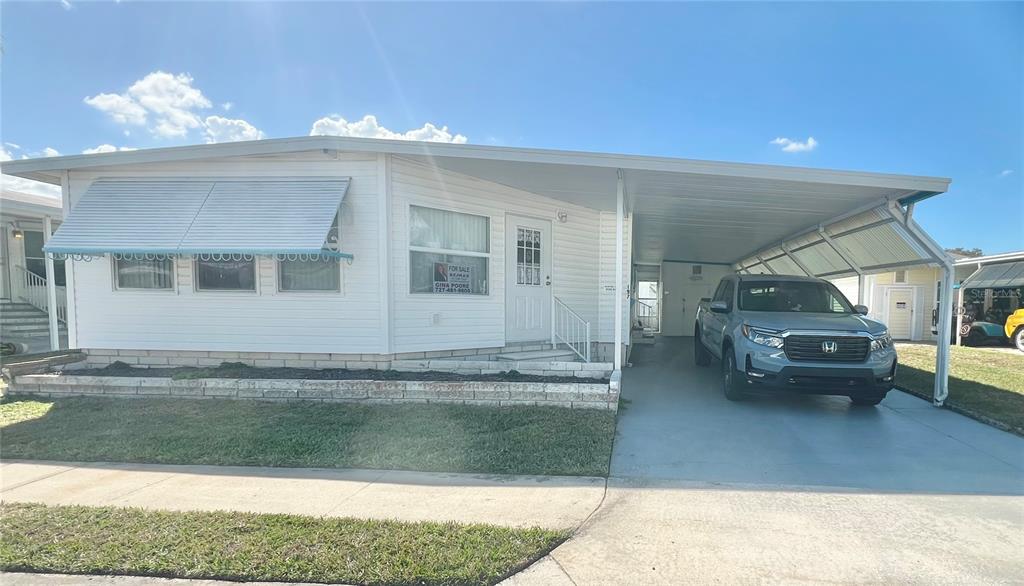 1100 South Belcher Road, Unit 197 Largo, FL 33771 - Photo 3 of 60 a view of living room and kitchen