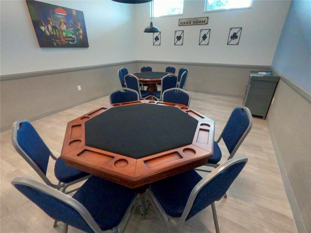 1100 South Belcher Road, Unit 197 Largo, FL 33771 - Photo 49 of 60 a blue chair sitting in a kitchen next to a lamp