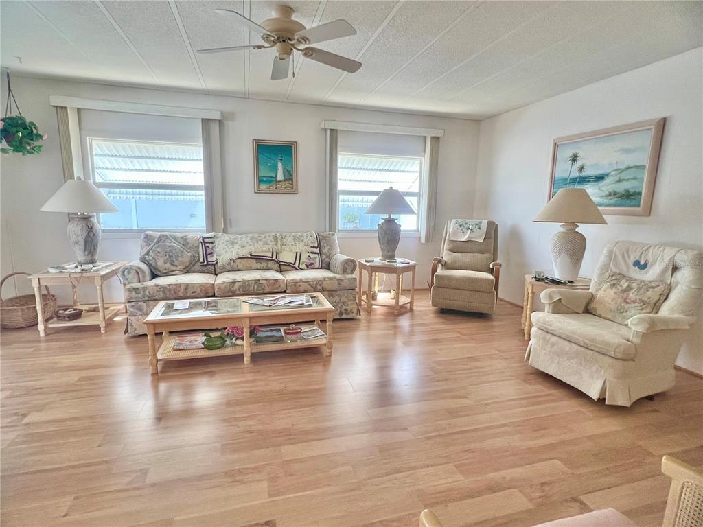 1100 South Belcher Road, Unit 197 Largo, FL 33771 - Photo 7 of 60 a living room with furniture and wooden floor