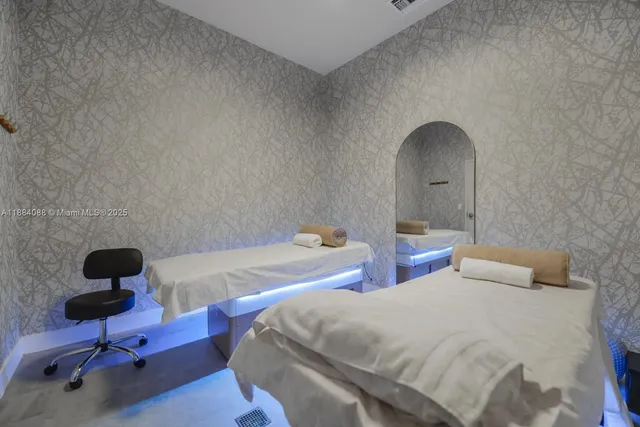 a bedroom with a bed and a chair