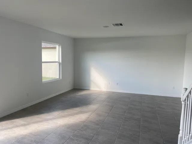 a view of an empty room and window