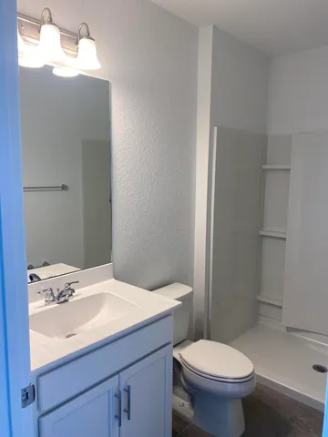 a bathroom with a sink toilet and vanity