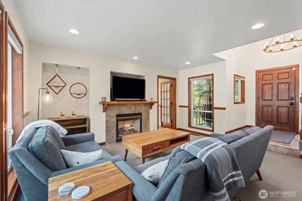 a bedroom with furniture and a fireplace
