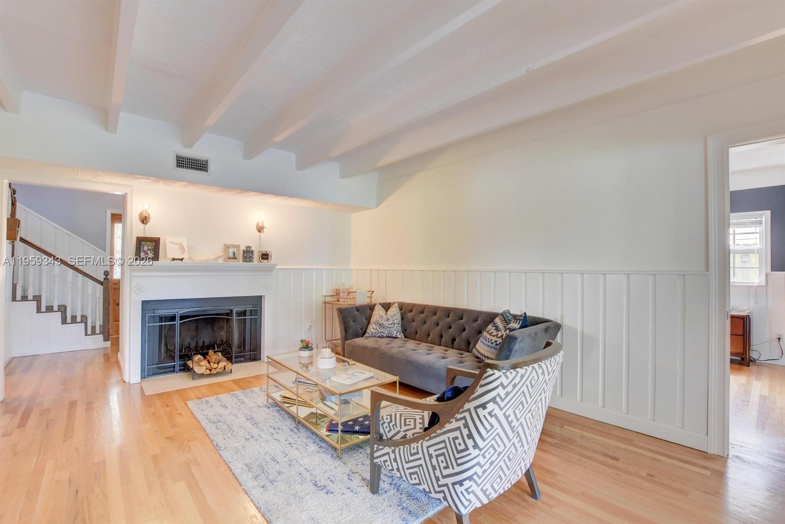1210 Southwest 19th Street Boca Raton, FL 33486 - Photo 11 of 43 a living room with furniture and a fireplace