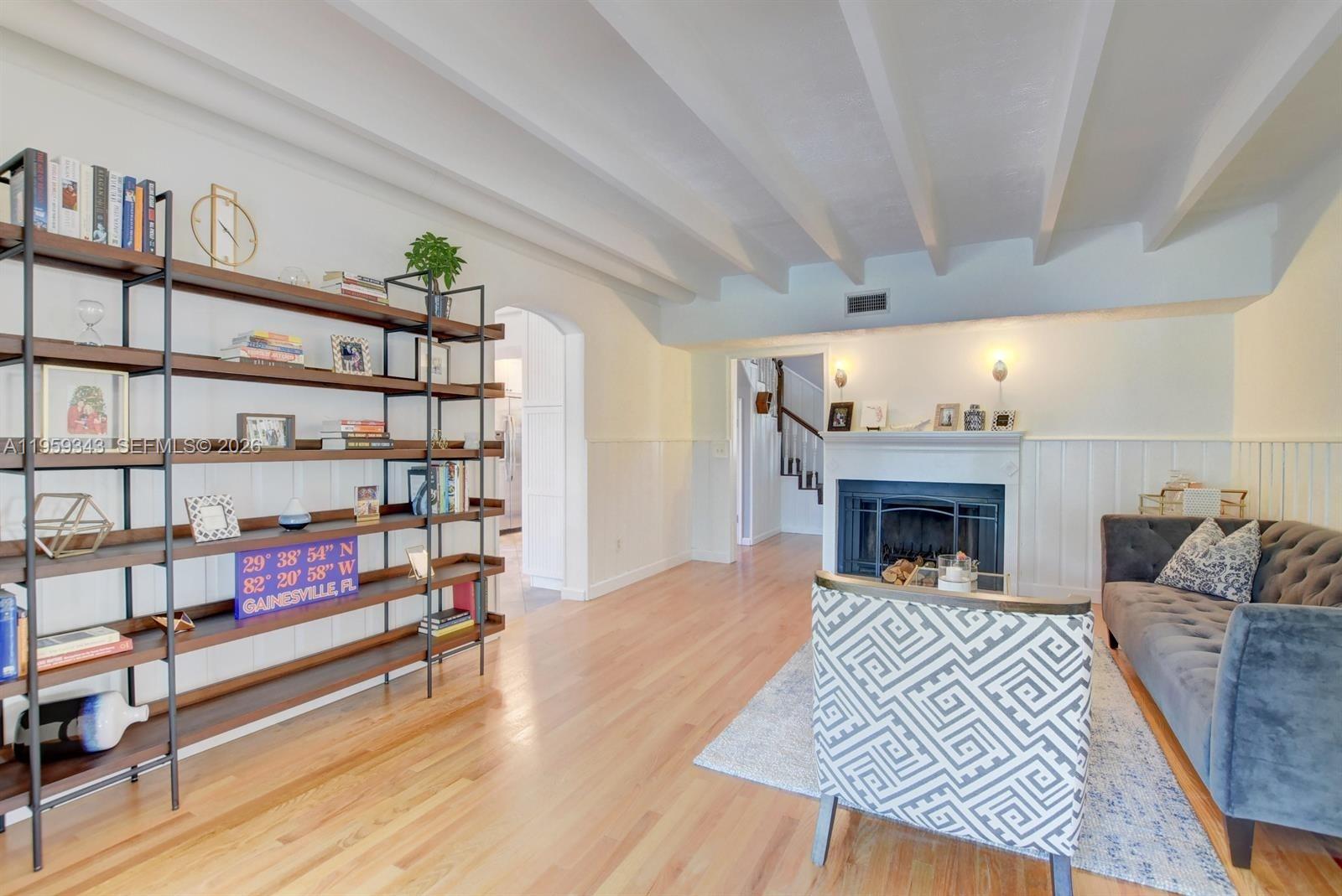1210 Southwest 19th Street Boca Raton, FL 33486 - Photo 12 of 43 a living room with furniture and a fireplace