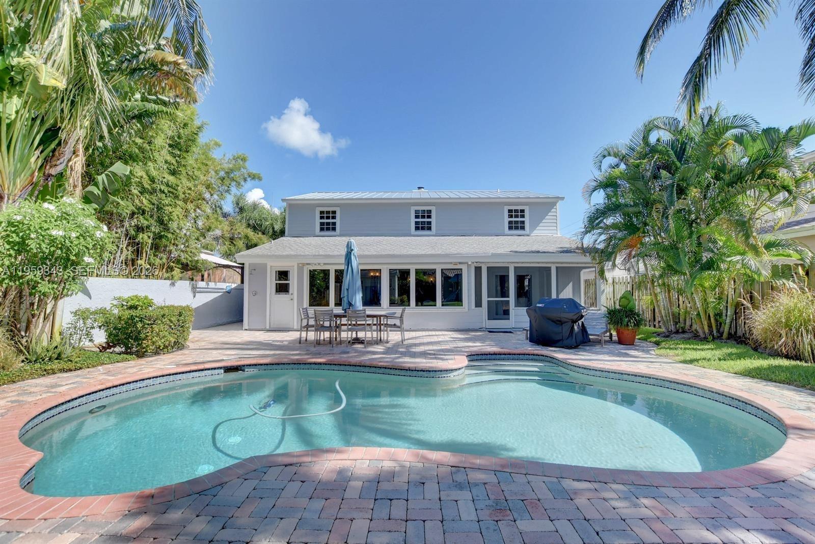 1210 Southwest 19th Street Boca Raton, FL 33486 - Photo 36 of 43 a view of house with outdoor space and swimming pool