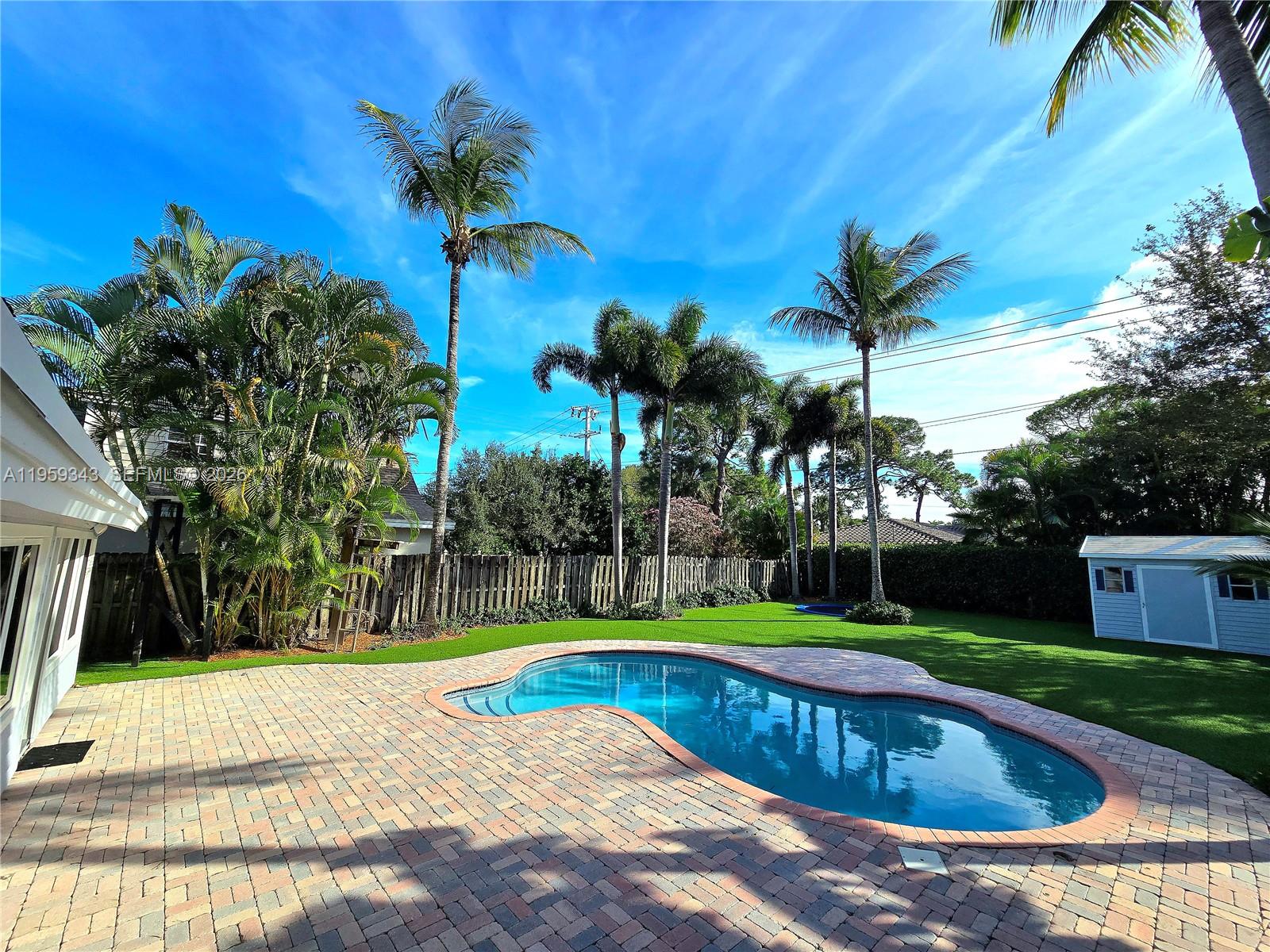 1210 Southwest 19th Street Boca Raton, FL 33486 - Photo 4 of 43 a view of swimming pool with a yard and palm tree