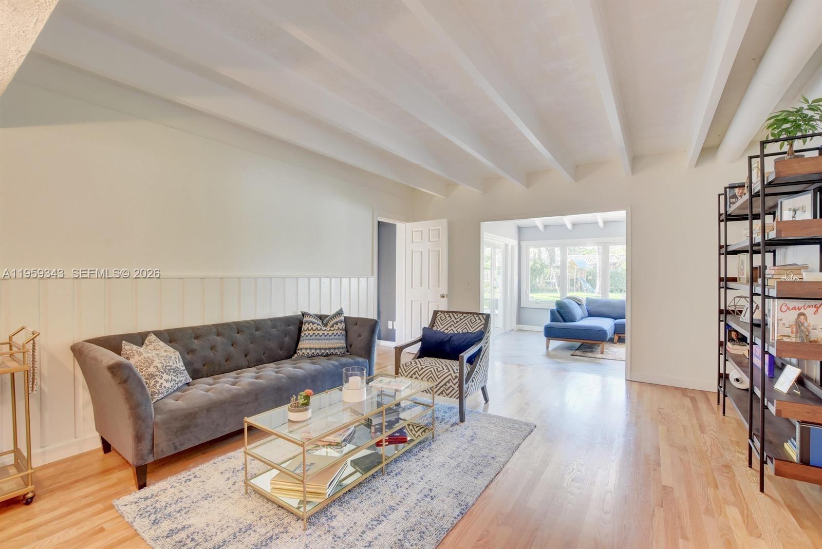 1210 Southwest 19th Street Boca Raton, FL 33486 - Photo 10 of 43 a living room with furniture and a wooden floor