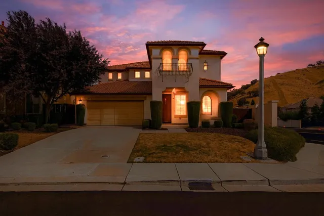 a front view of a house with yard