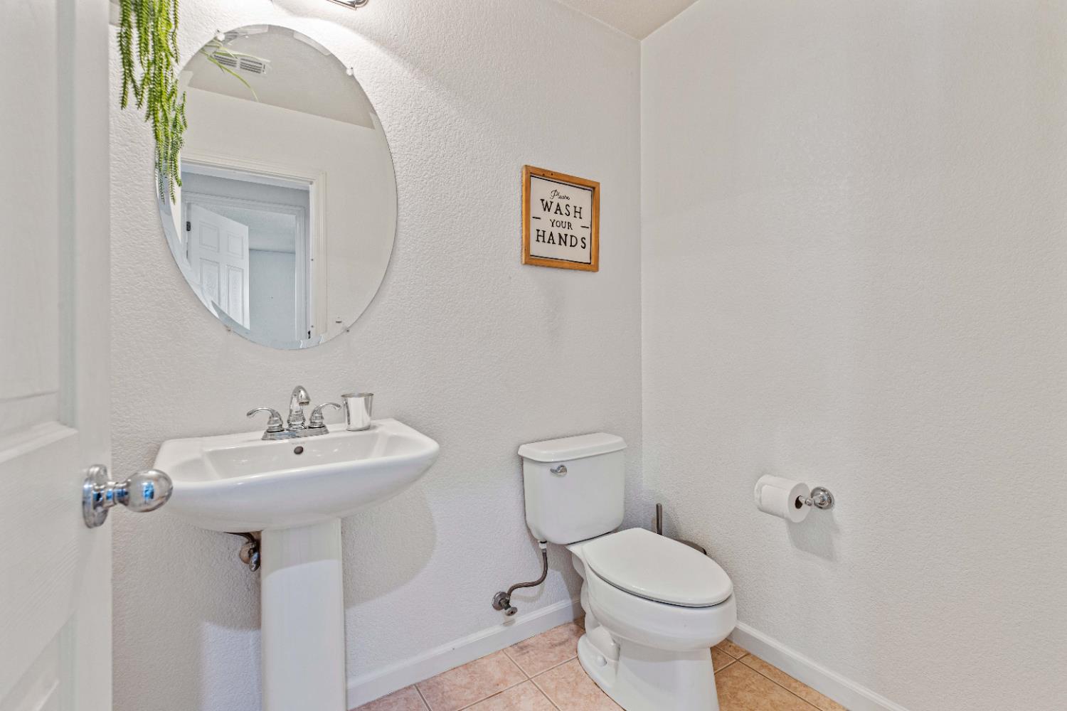 9015 Tee Patterson, CA 95363 - Photo 11 of 36 a bathroom with a toilet sink and mirror