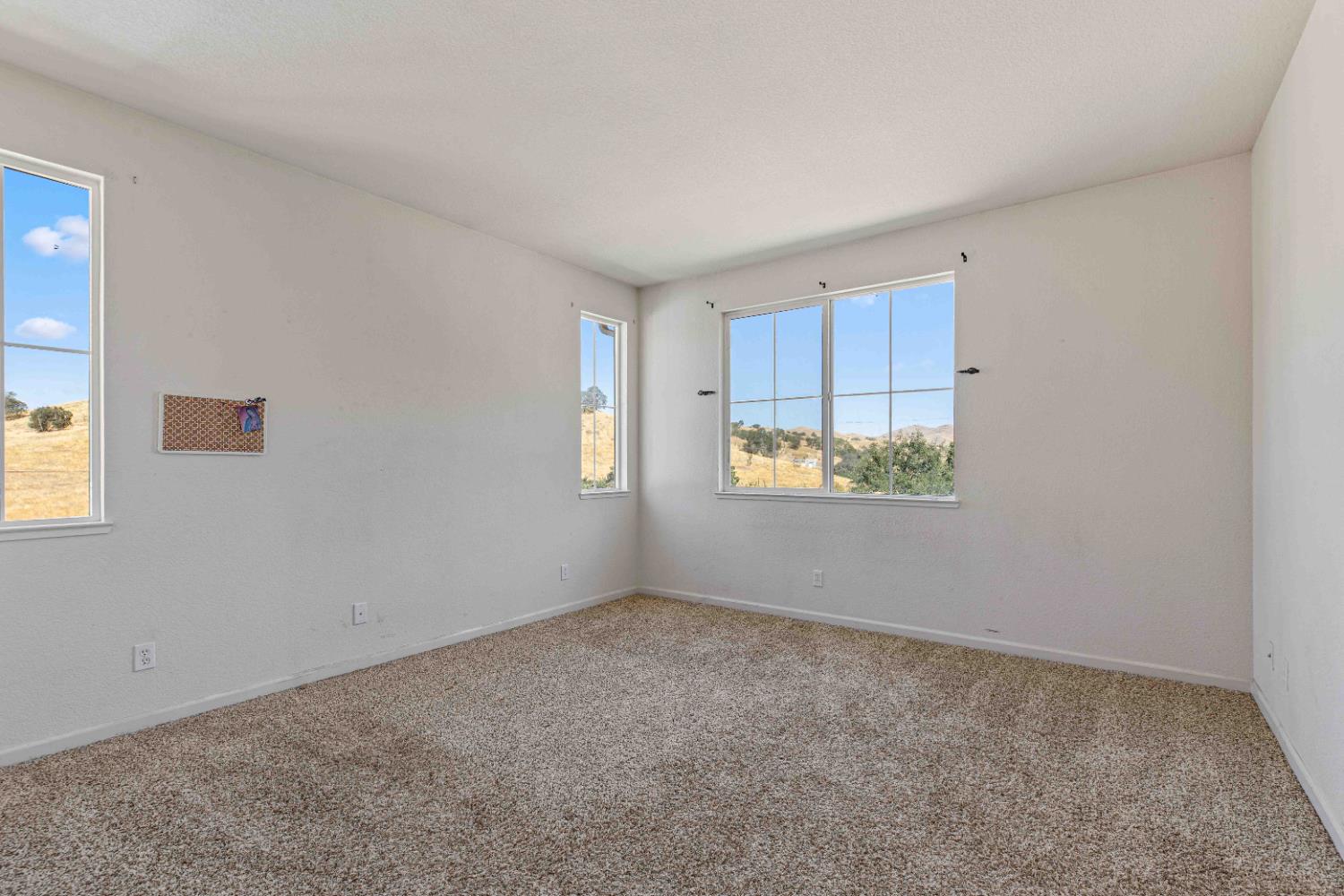 9015 Tee Patterson, CA 95363 - Photo 17 of 36 a view of an empty room with a window