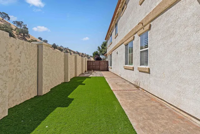 a view of a back yard of the house