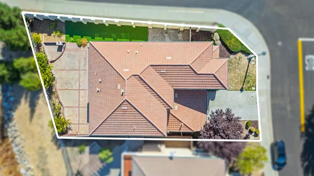 a view of swimming pool with a yard and table and chairs