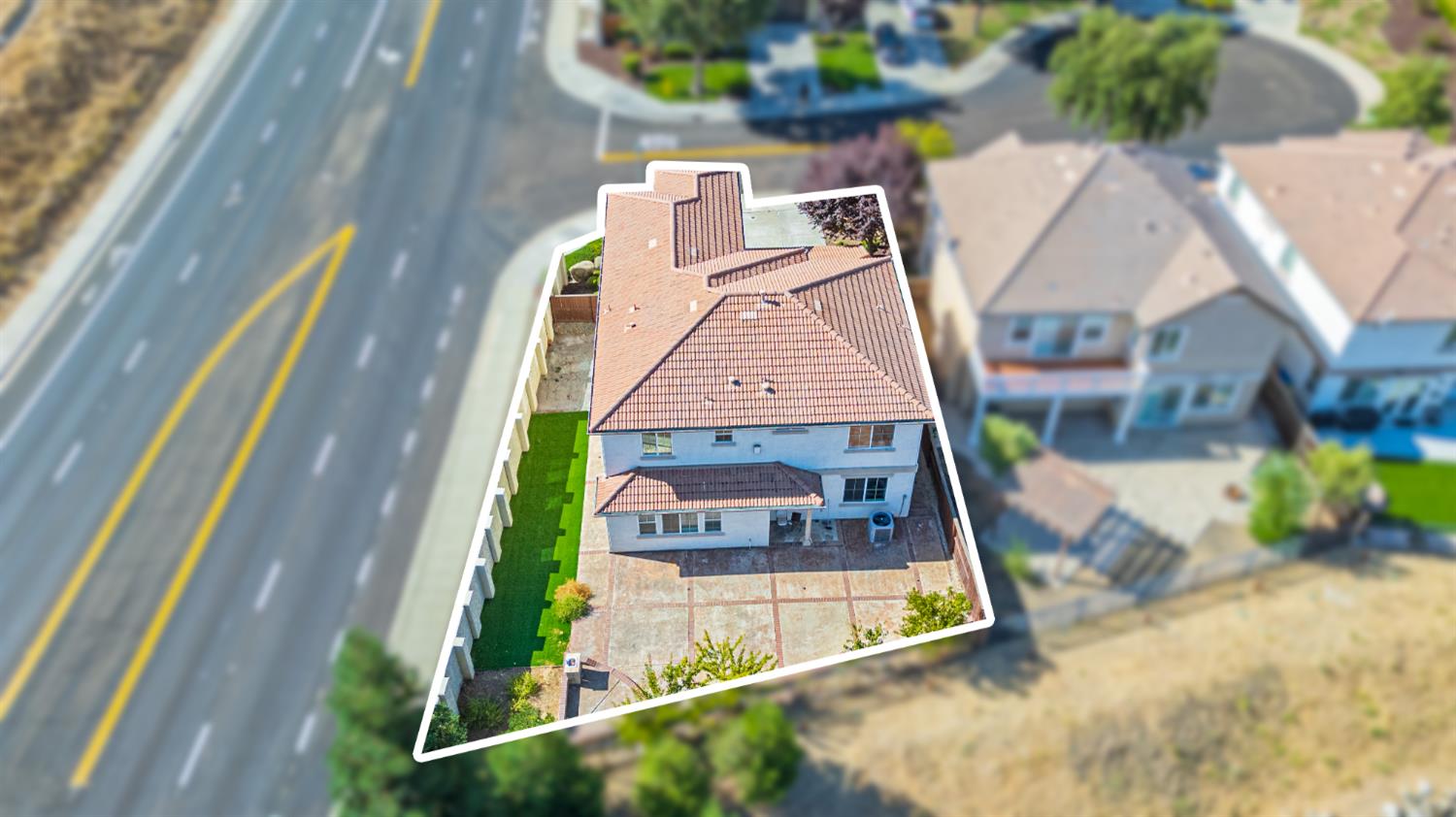 9015 Tee Patterson, CA 95363 - Photo 32 of 36 an aerial view of a house with a swimming pool