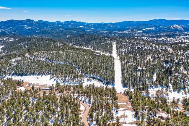 a view of a city with mountains in the background