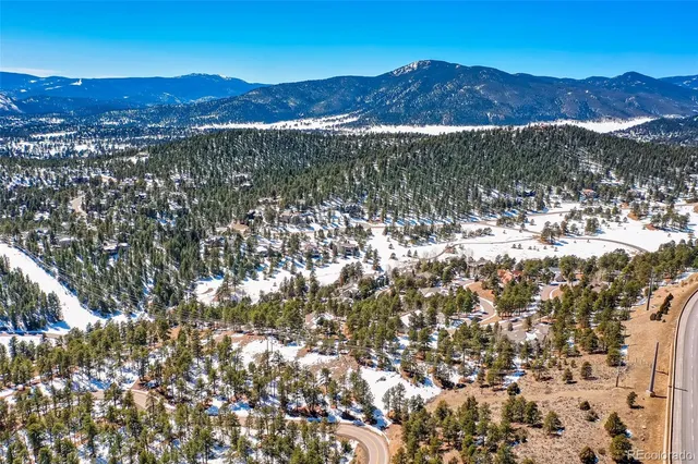 a view of a mountain with a mountain in the background