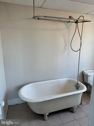 a bathroom with a bath tub and a shower