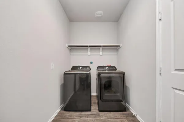a view of storage and utility room with washer and dryer