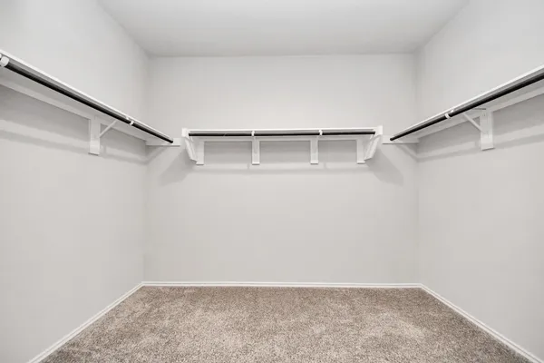 a view of an empty walk in closet