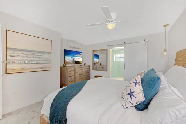 a bathroom with a double vanity sink toilet and mirror