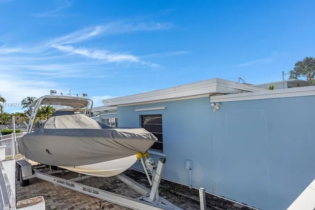 a view of a house with a yard from a fountain