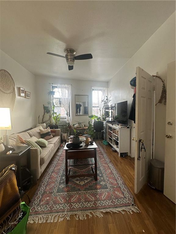 7304 5th Avenue Brooklyn, NY 11209 - Photo 2 of 8 a living room with furniture and a flat screen tv