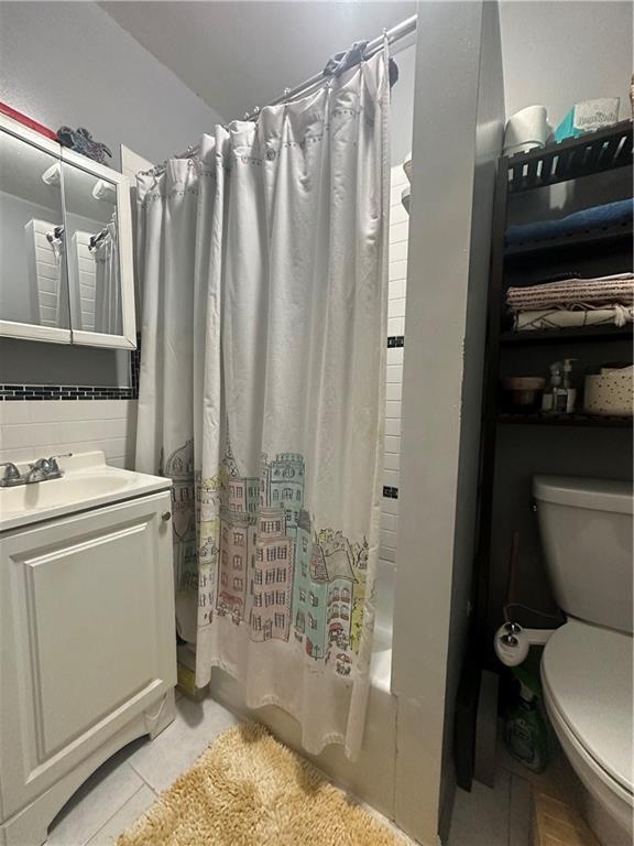 7304 5th Avenue Brooklyn, NY 11209 - Photo 5 of 8 a bathroom with a sink a toilet and shower