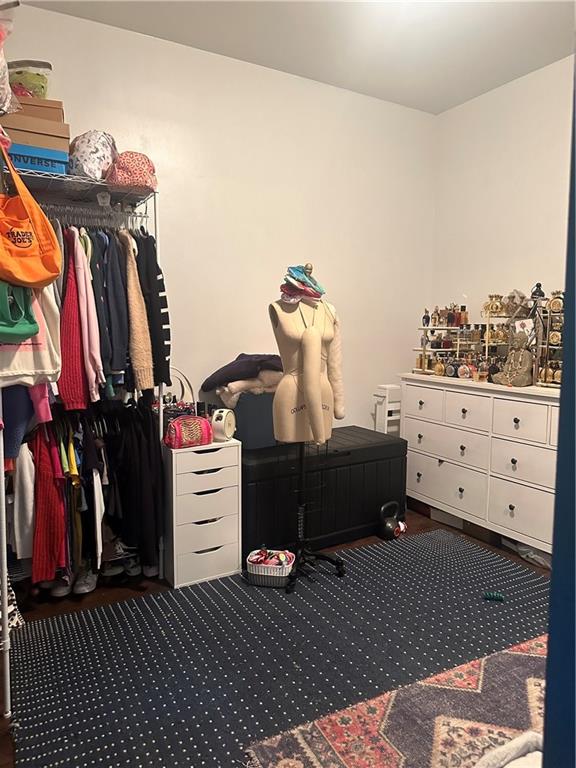 7304 5th Avenue Brooklyn, NY 11209 - Photo 7 of 8 a room with a closet and a mirror