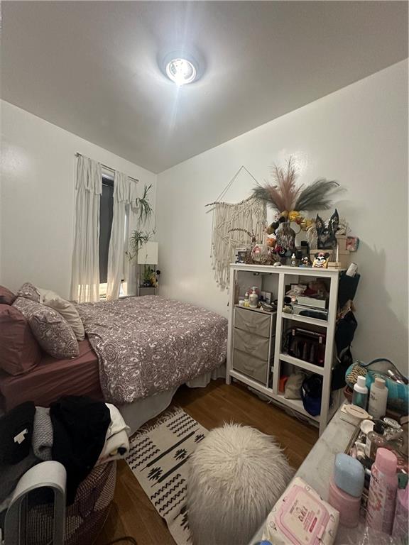 7304 5th Avenue Brooklyn, NY 11209 - Photo 8 of 8 a bedroom with bed and a couch