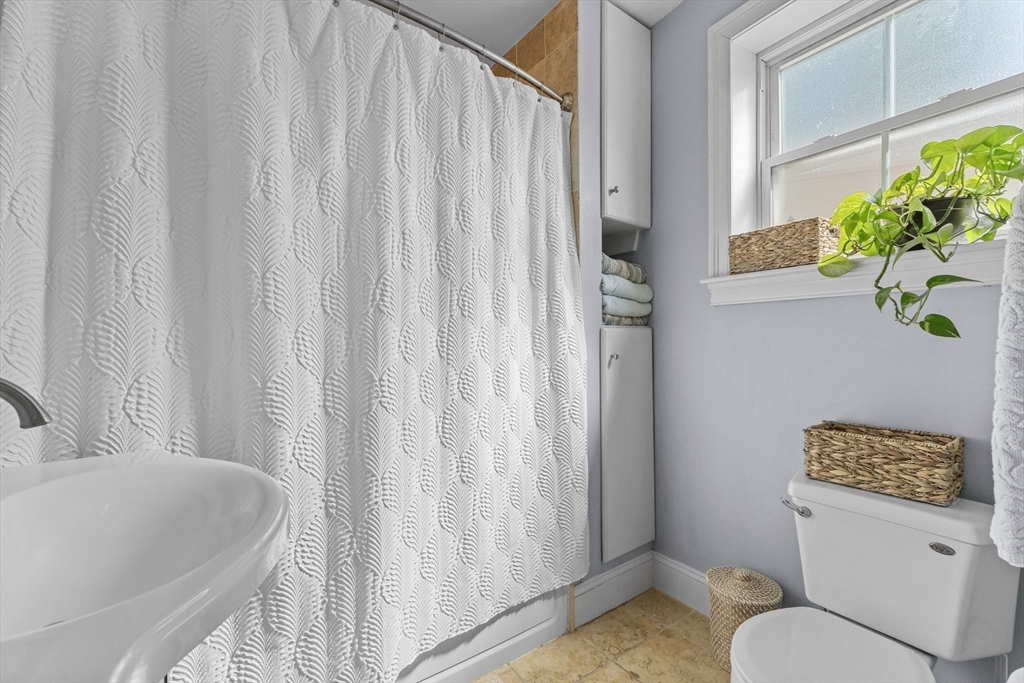 10 Mitchell Street, Unit 3 Boston, MA 02127 - Photo 8 of 15 a bathroom with a toilet and shower