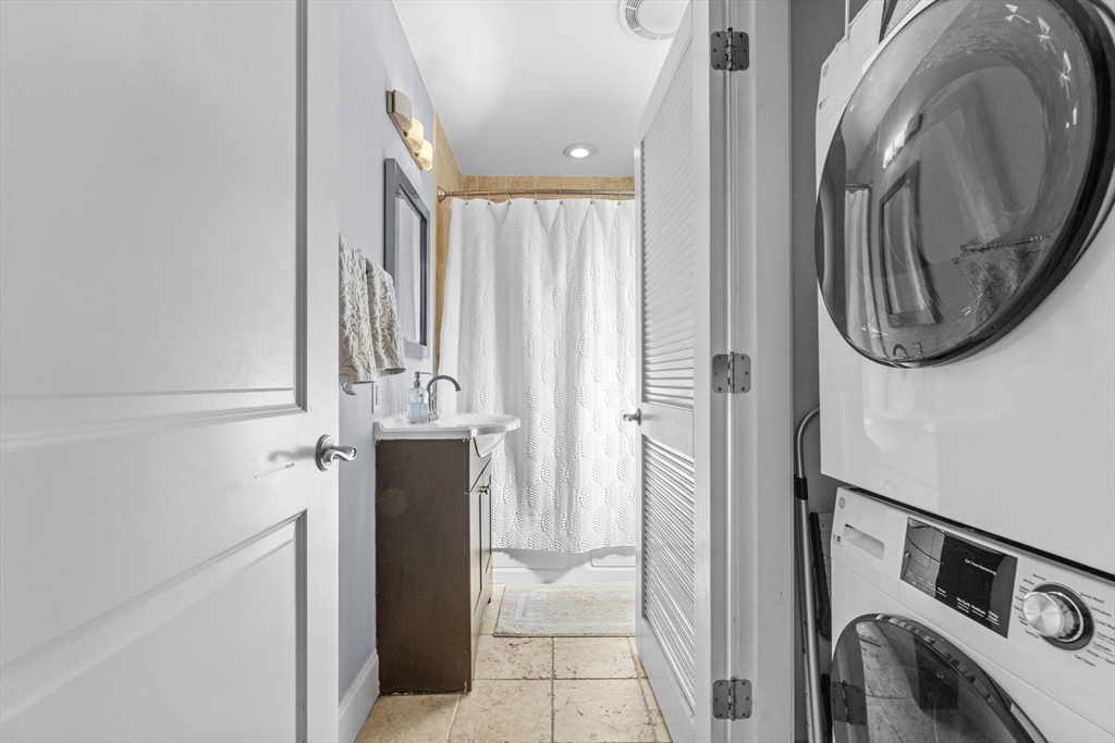 10 Mitchell Street, Unit 3 Boston, MA 02127 - Photo 9 of 15 a view of a hallway with washer and dryer