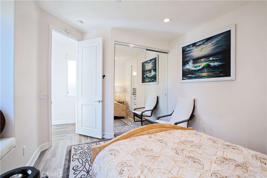 610 17th Street Huntington Beach, CA 92648 - Photo 13 of 64 a bedroom with a bed and furniture