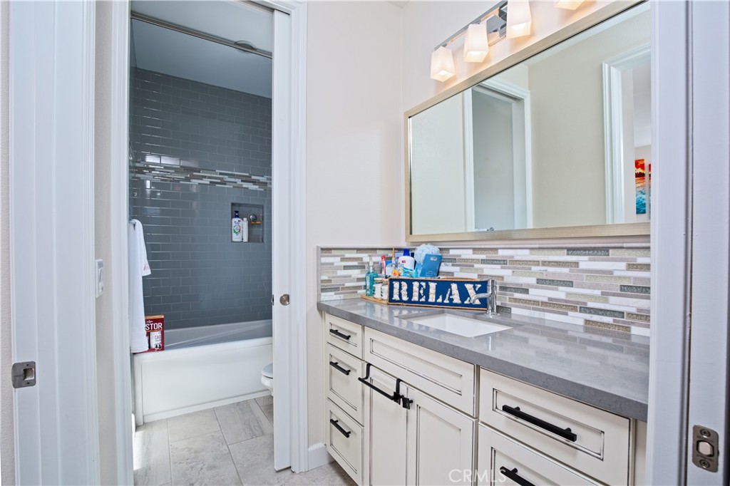 610 17th Street Huntington Beach, CA 92648 - Photo 15 of 64 a bathroom with a sink and a bathtub