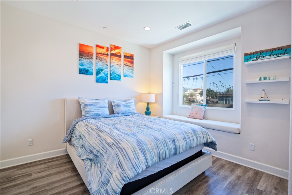 610 17th Street Huntington Beach, CA 92648 - Photo 16 of 64 a bedroom with bed and window
