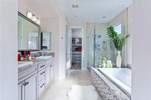 a bathroom with a tub and shower