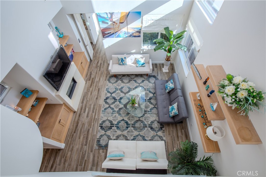 610 17th Street Huntington Beach, CA 92648 - Photo 26 of 64 view of living room with furniture and a potted plant