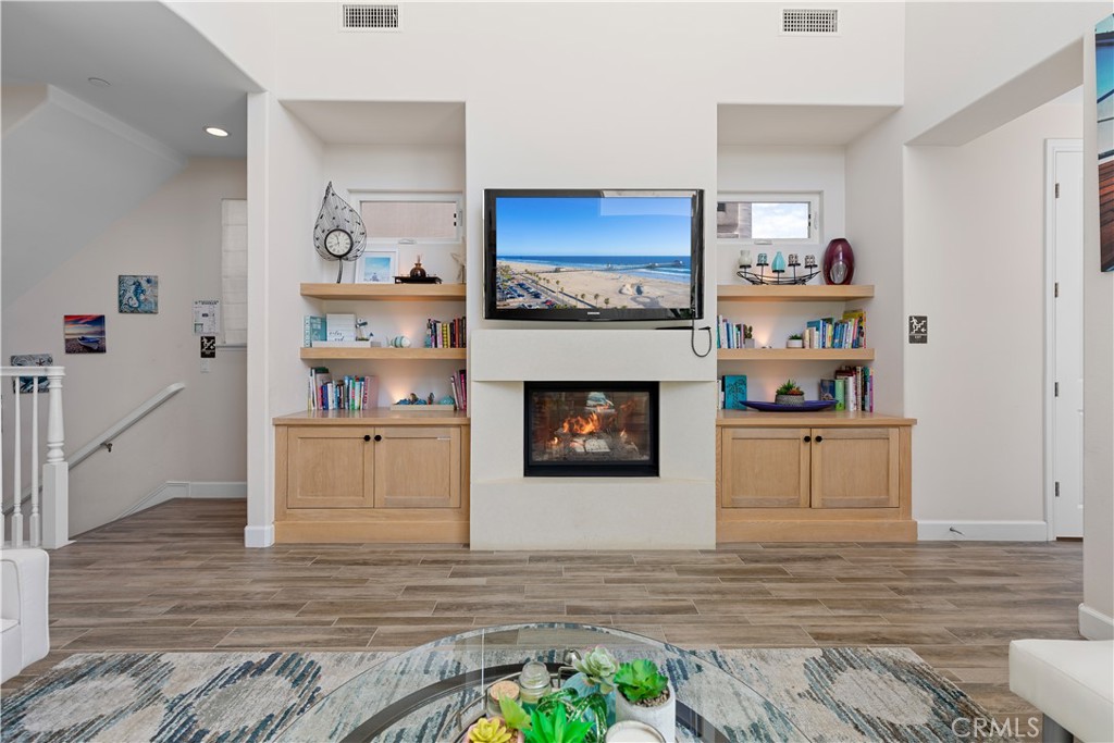 610 17th Street Huntington Beach, CA 92648 - Photo 3 of 64 a room with furniture and a fireplace
