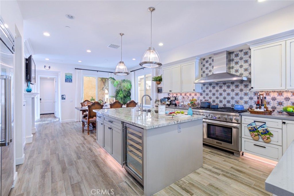 610 17th Street Huntington Beach, CA 92648 - Photo 32 of 64 a kitchen with stainless steel appliances a stove sink and cabinets