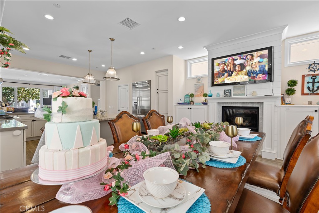 610 17th Street Huntington Beach, CA 92648 - Photo 4 of 64 a living room with furniture a fireplace and a flat screen tv