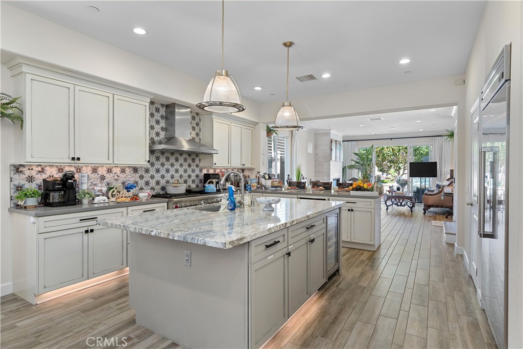 610 17th Street Huntington Beach, CA 92648 - Photo 45 of 64 a kitchen with sink stove and cabinets