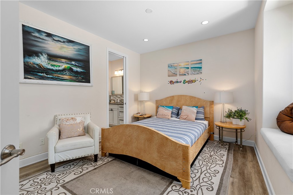 610 17th Street Huntington Beach, CA 92648 - Photo 50 of 64 a bedroom with a bed and a couch