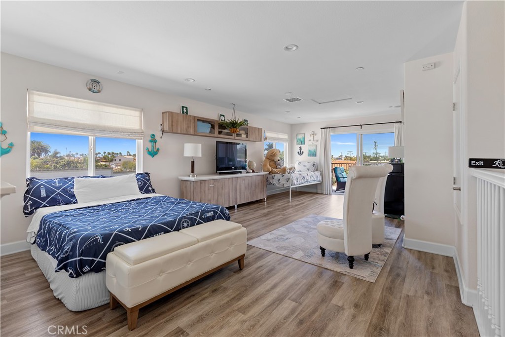 610 17th Street Huntington Beach, CA 92648 - Photo 53 of 64 a living room with a bed furniture and a large window